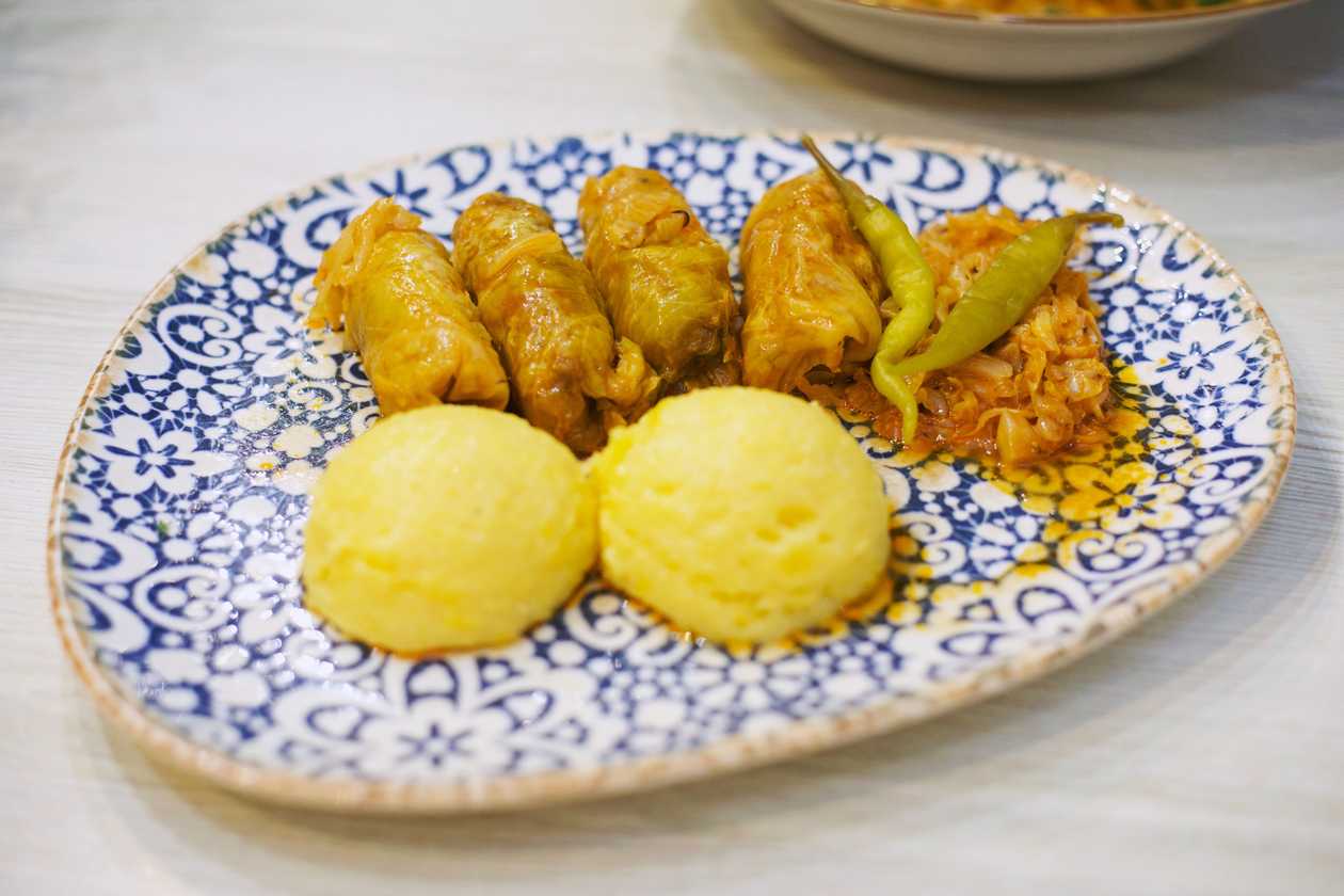 Traditional cabbage meat rolls with polenta and hot peppers