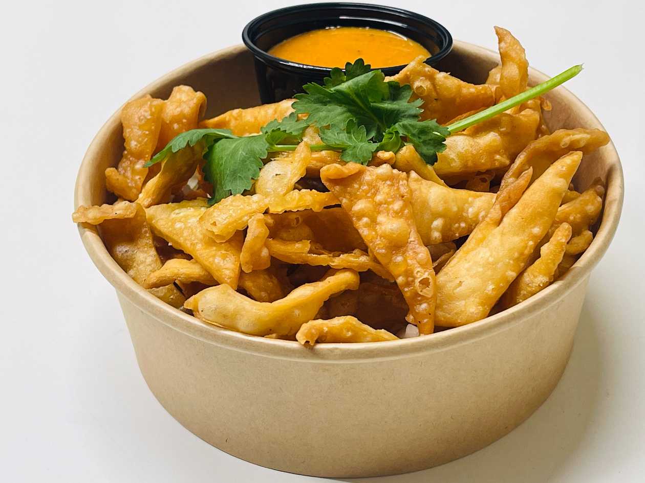 Hand made fried crispy chips with spicy sauce