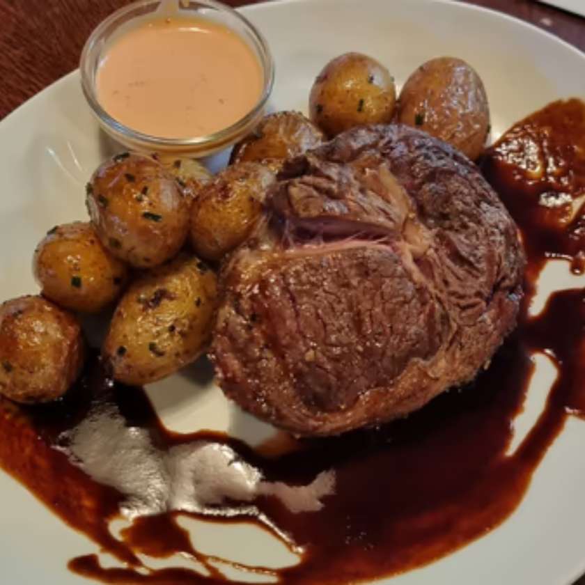 Rib Eye Steak (South America), Roasted Grenaille with Garlic and Chives, Chilli Dip, Demi Glace Sauce