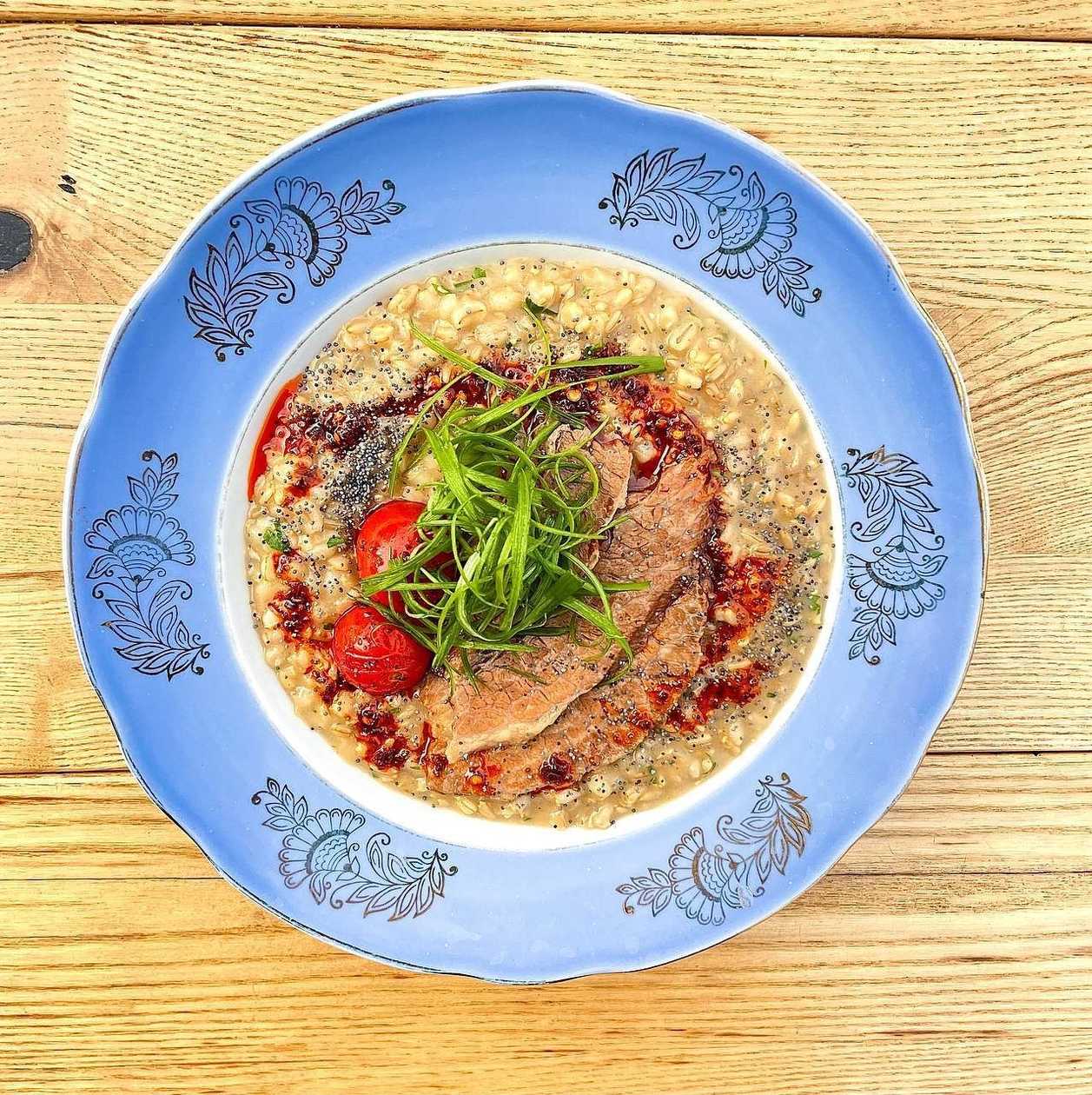 porridge with brisket and tomatoes