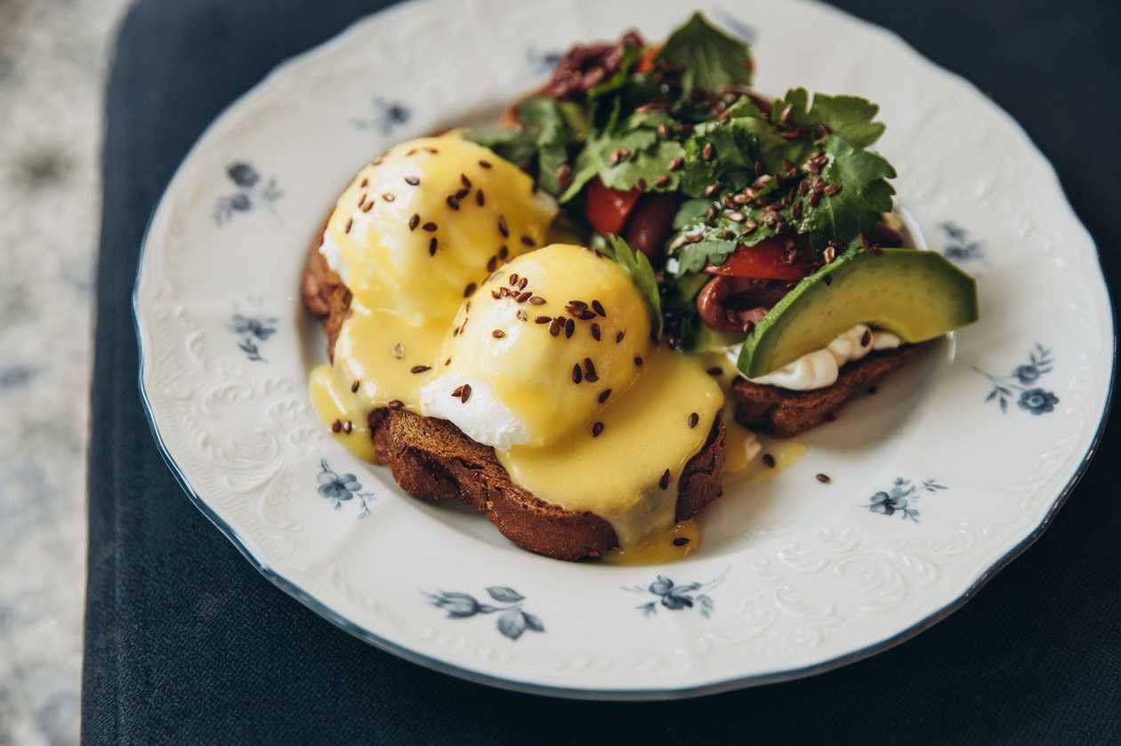 Eggs Benedict with Toast and Avocado