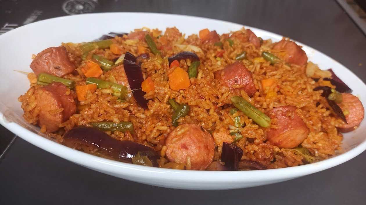 Jollof Rice with Fried Sausages and Gizzards