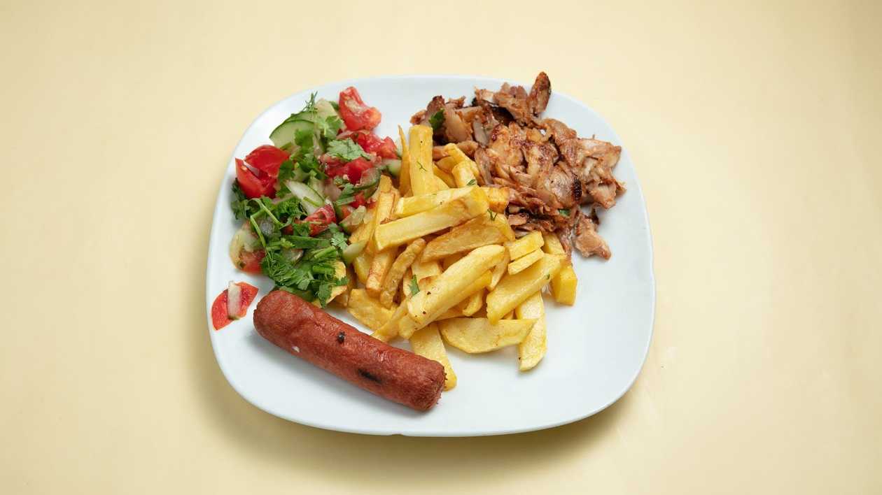 French Fries with Chicken Doner Meat, Sausage, Salad, and Bread