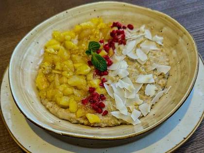 Oatmeal in coconut milk with caramelized pear and apple