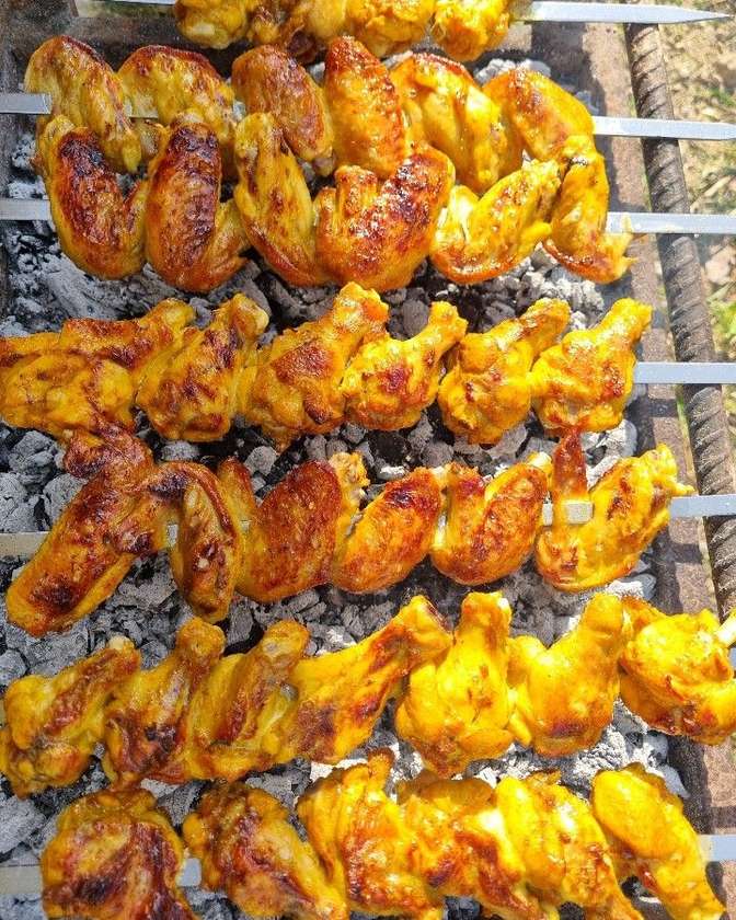 Family plate of grilled chicken with bread