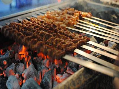 Family plate of dish with grilled beef and lamb with bread