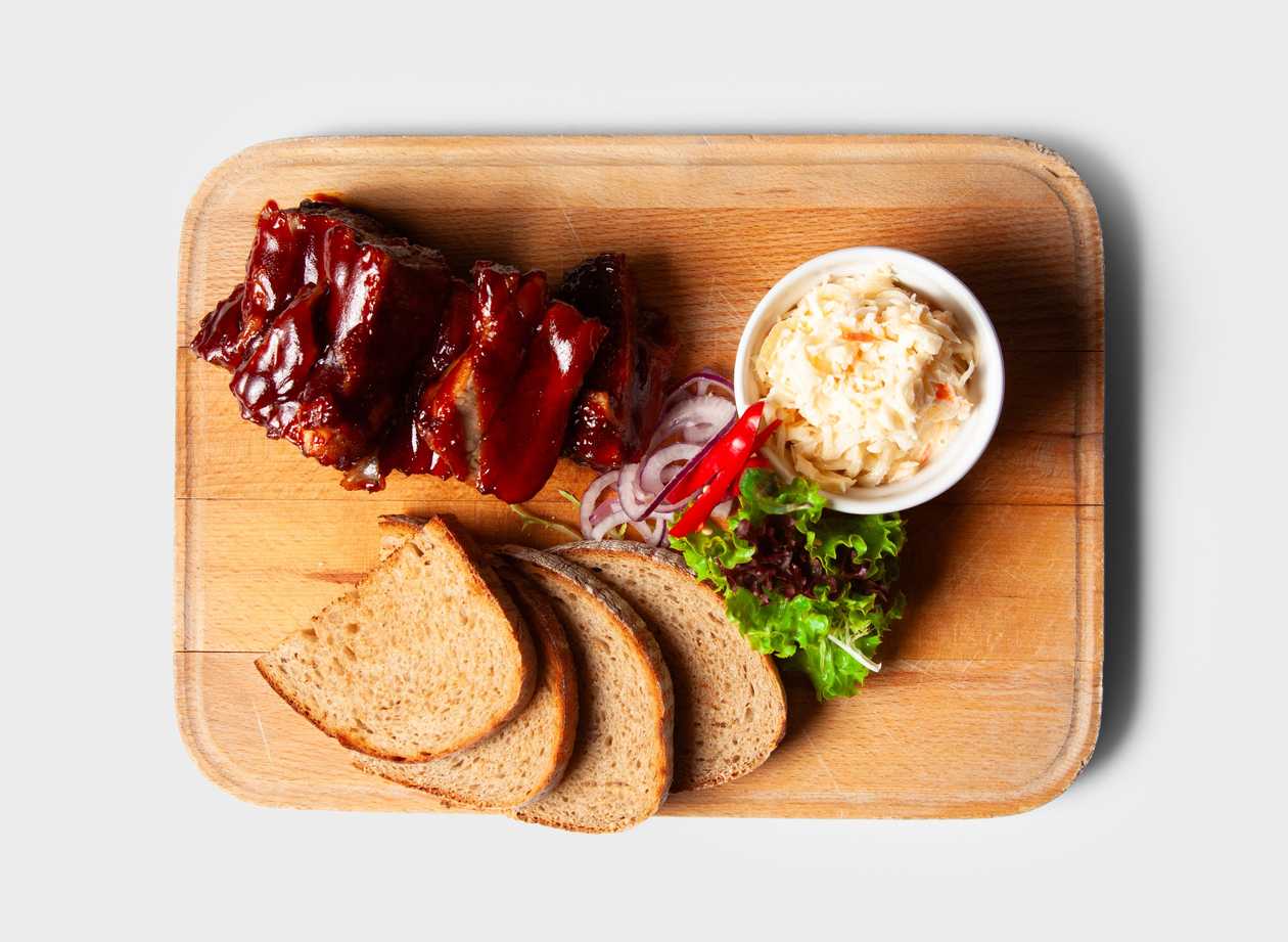 400g Roasted meaty ribs with BBQ sauce served with coleslaw salad and bread (A1a,b,3,7,9,10)