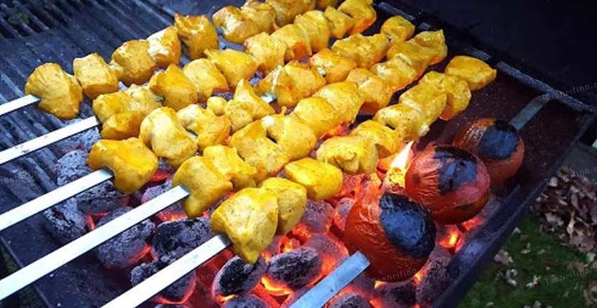 Family plate of grilled chicken breast skewers