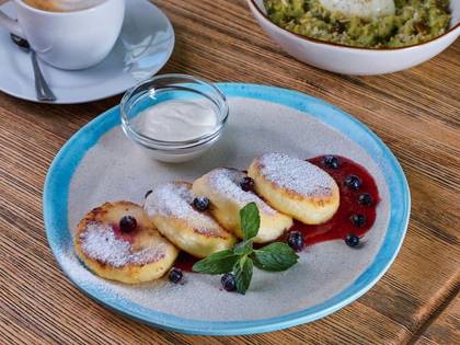 Syrniki with Berry Sauce and Sour Cream