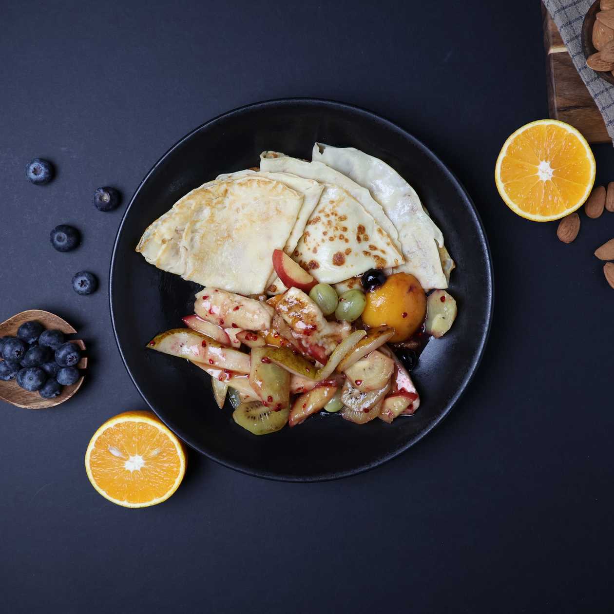 Thin pancakes with hot fruit