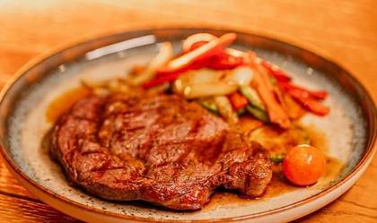 Ribeye Steak with Roasted Vegetables and Demi-Glace Sauce