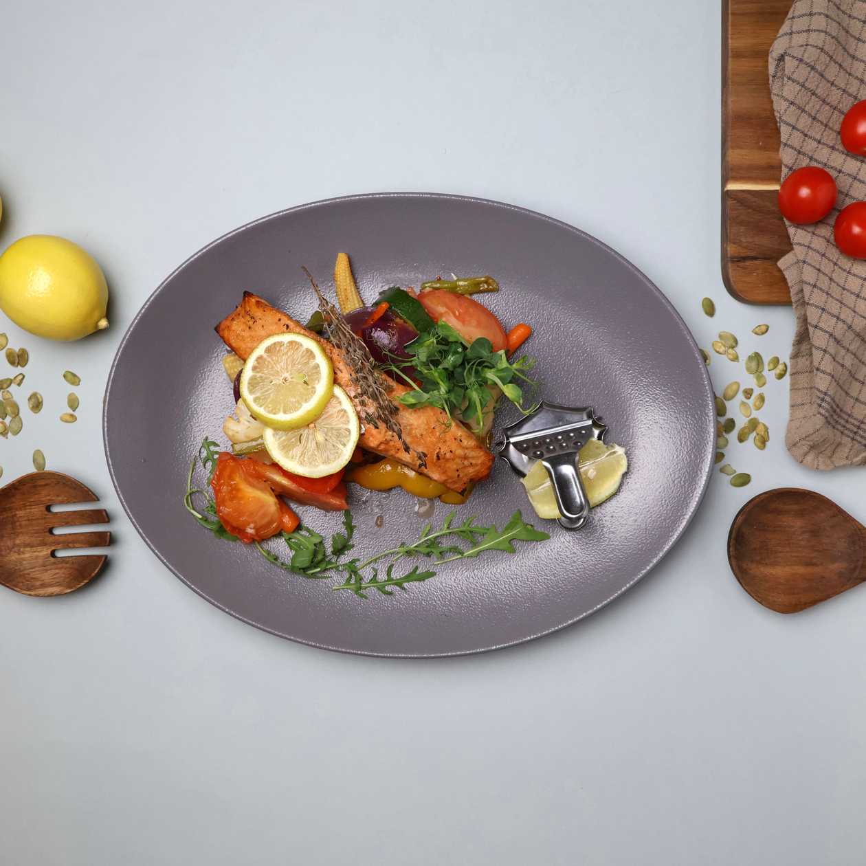 Salmon baked in the oven with grilled vegetables