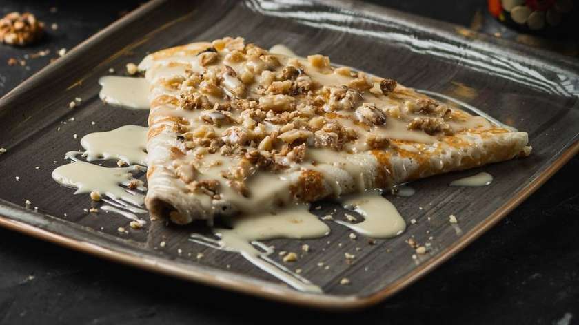 Pancake with condensed milk and walnuts