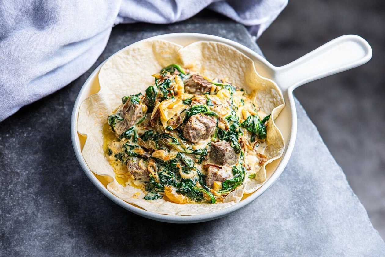 Beef in cream sauce with spinach