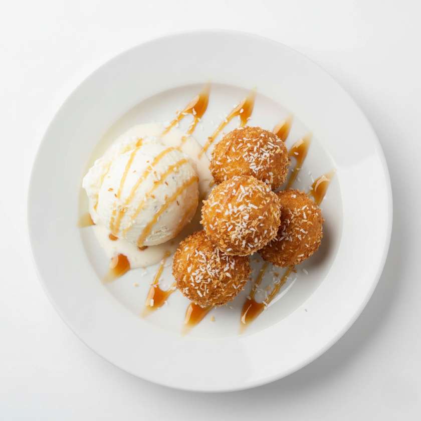 143.Banana balls with coconut flakes and ice cream.