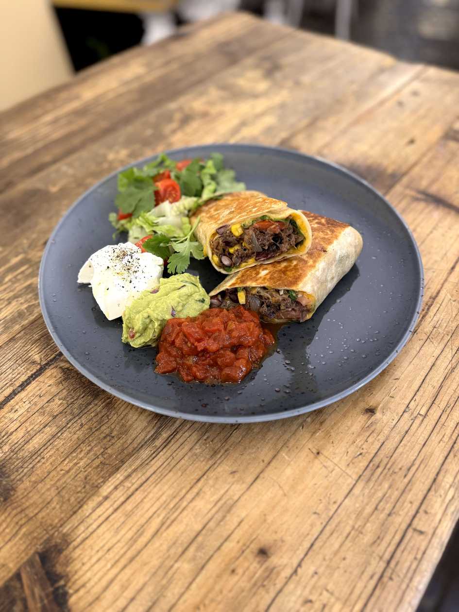 Burrito with pulled beef, salad and dips