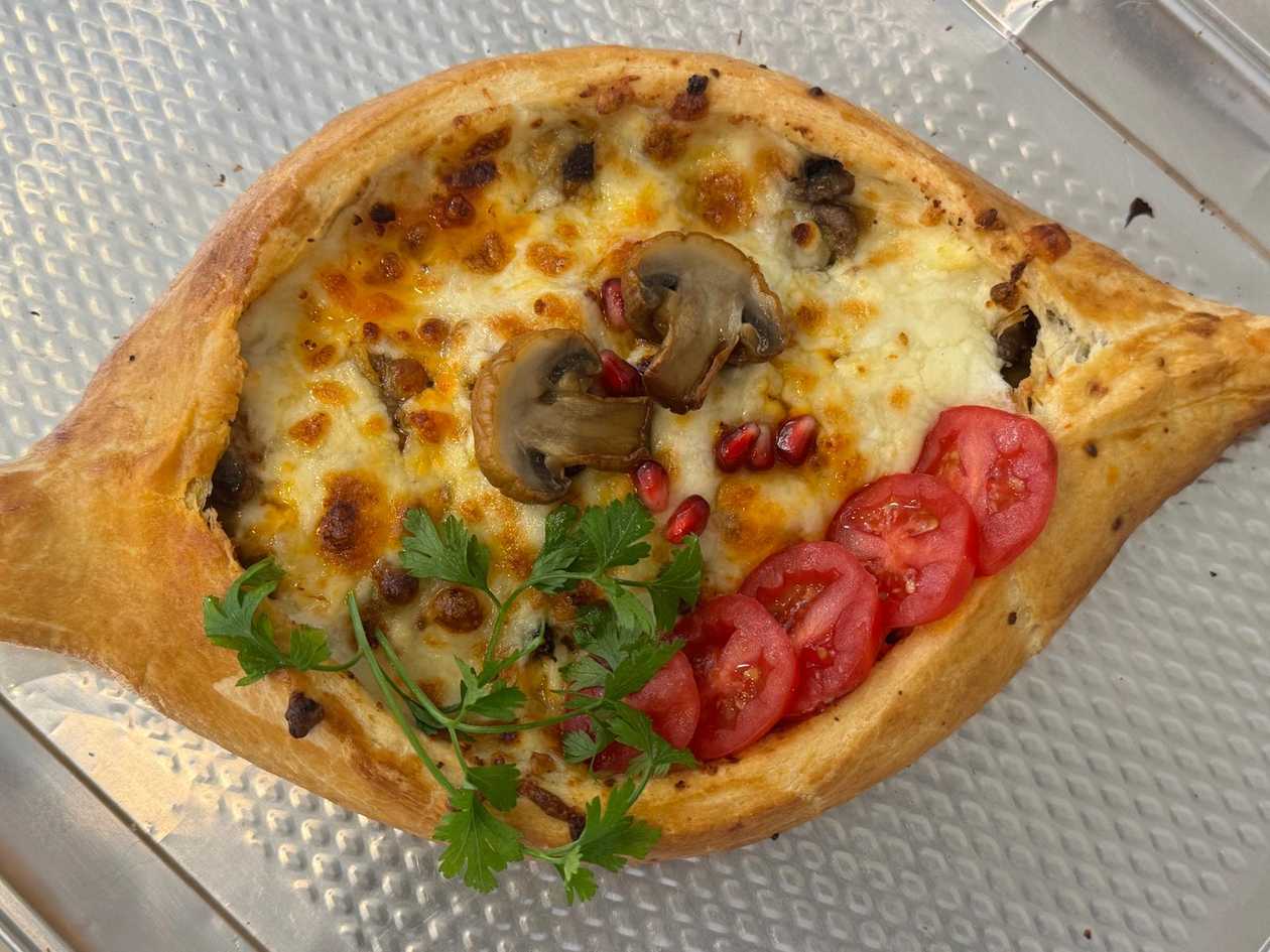 Khachapuri Adjaruli with Meat and Tomato