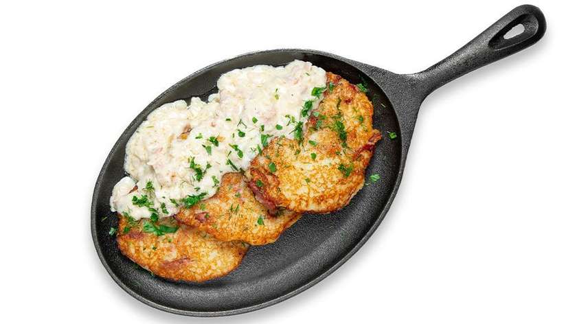 Potato pancakes stuffed with sausages, with bacon sauce