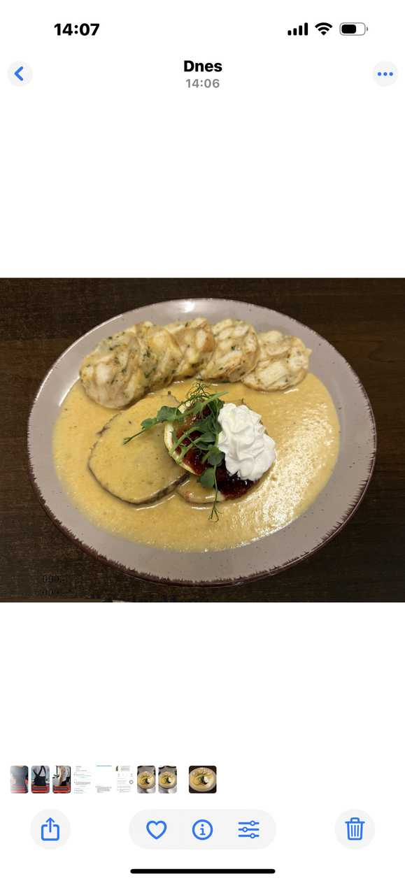 Svíčková: Beef sirloin in cream sauce, Carlsbad dumplings, cranberries, lemon