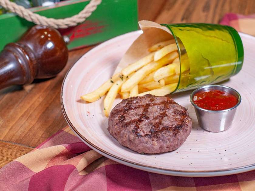 Marbled beef steak served with spicy potatoes