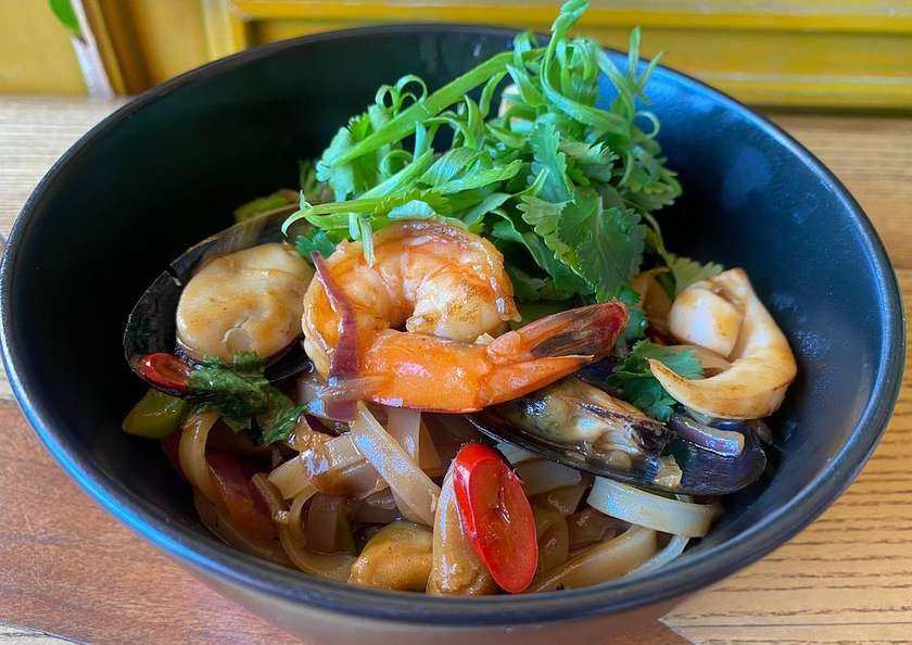Rice noodles with seafood in Pad Thai sauce