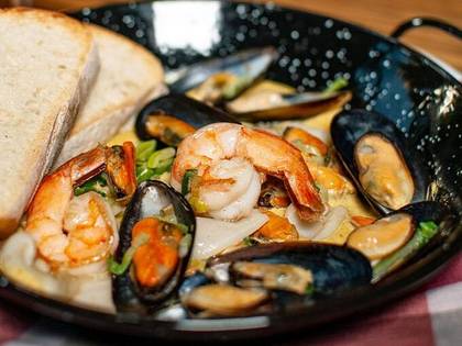 Seafood saute in saffron sauce