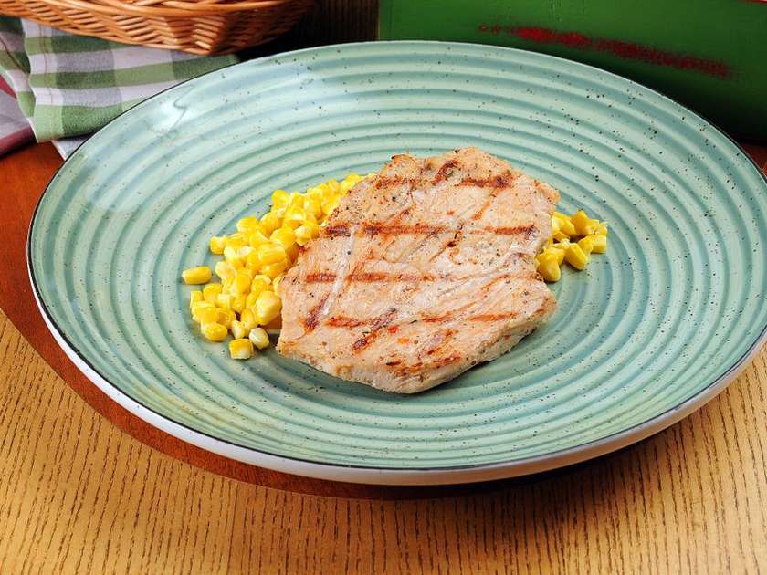 Turkey Steak on a Bed of Corn in Creamy Parmesan Sauce