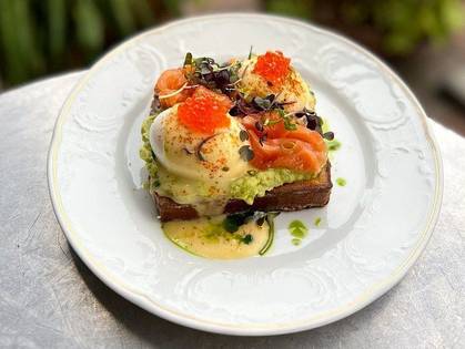 Avocado toast with salmon, fish hollandaise and red caviar