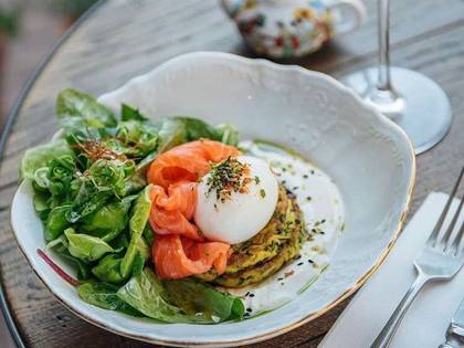 Zucchini pancakes with salmon, soft egg and Greek yogurt