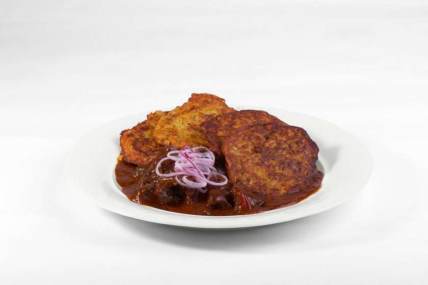 Beef goulash with potato pancakes