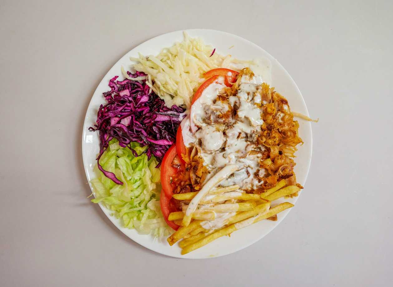 Chicken kebab plate with fries
