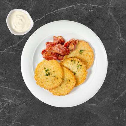 Potato pancakes with crispy bacon