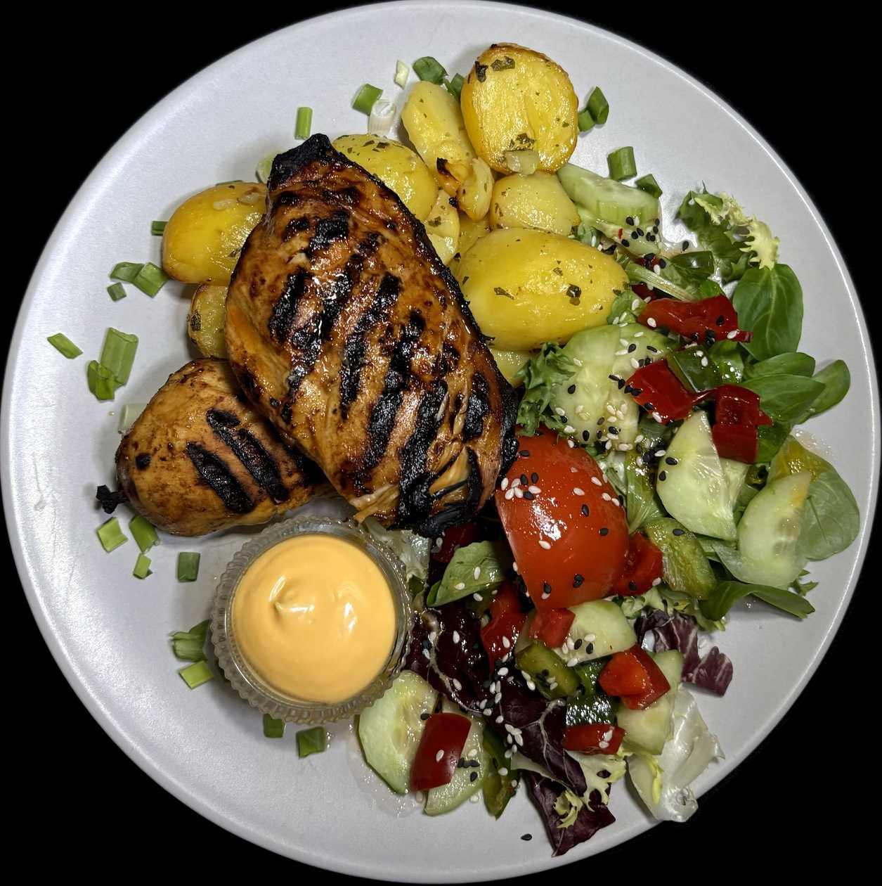 Chicken breast in chili - worcestershire marinade, served with baked potatoes and cheese sauce