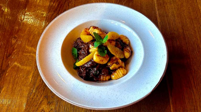 Pulled beef in orange, mint and chili with potato gnocchi