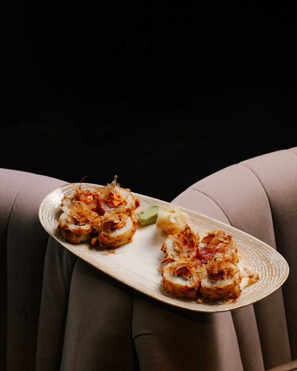 Hot roll with salmon, Philadelphia cheese in almond flakes