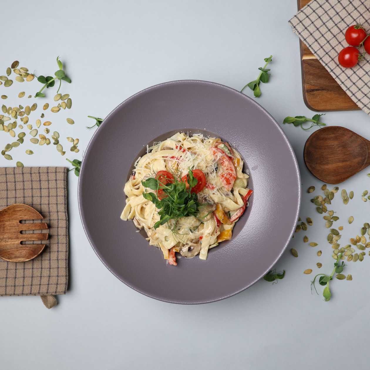 Pasta with vegetables in cream sauce