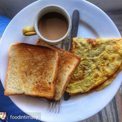 Tea and egg with toasted bread