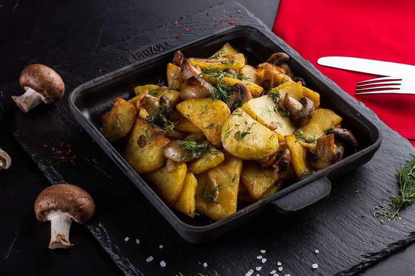 Fried homemade potatoes with mushrooms