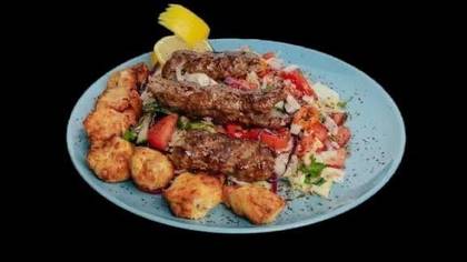 Salad with meat on plate