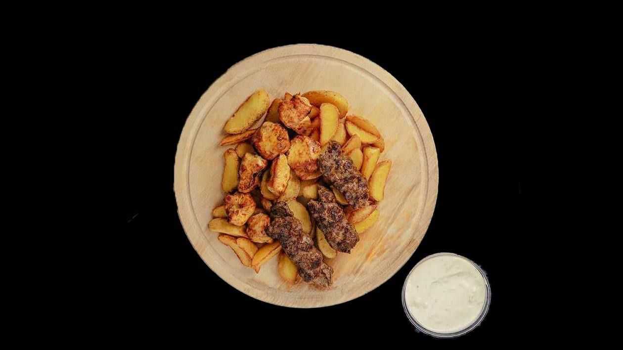 Potato wedges with meat on a plate