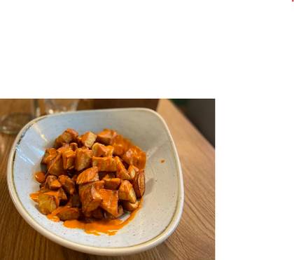 Patatas bravas with tomato and pepper sauce