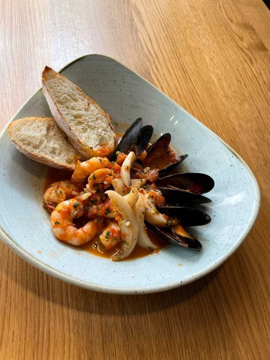 Seafood saute in creamy tomato sauce