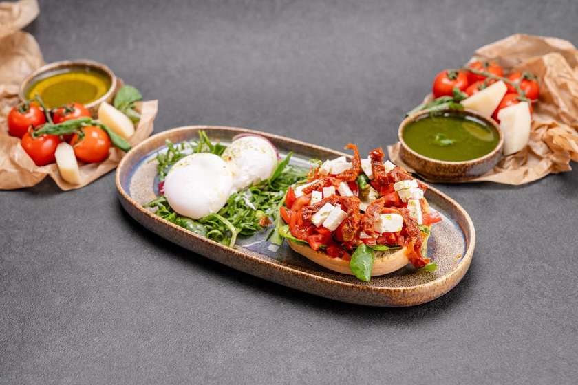 Frisella with Caprese Salad and Poached Egg