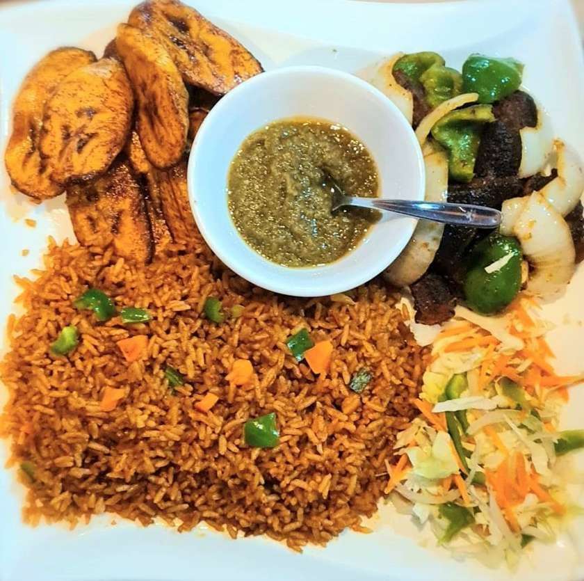 Jollof Rice with Goat meat and Fried Ripped Plantain
