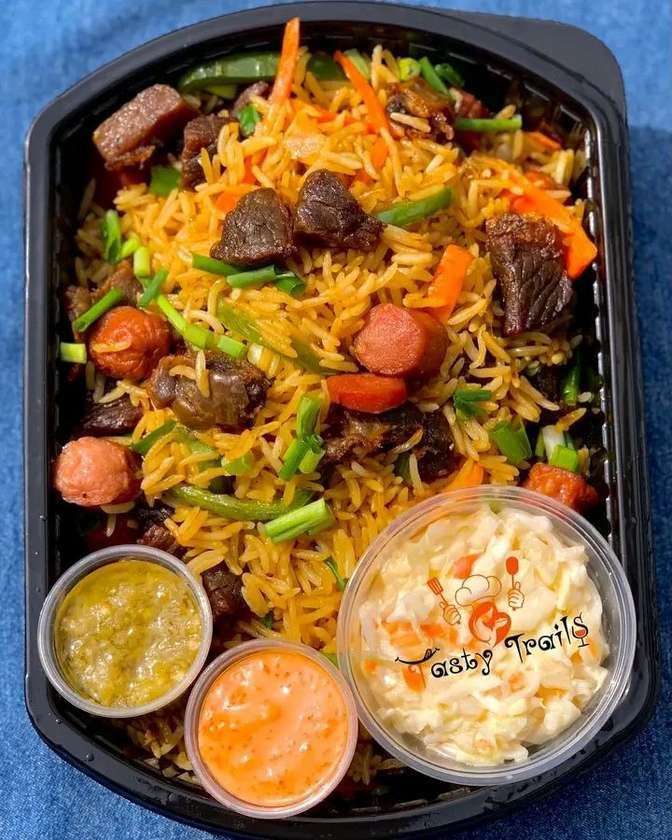 GIZZARD AND SAUSAGE JOLLOF RICE,  AND PLANTAIN