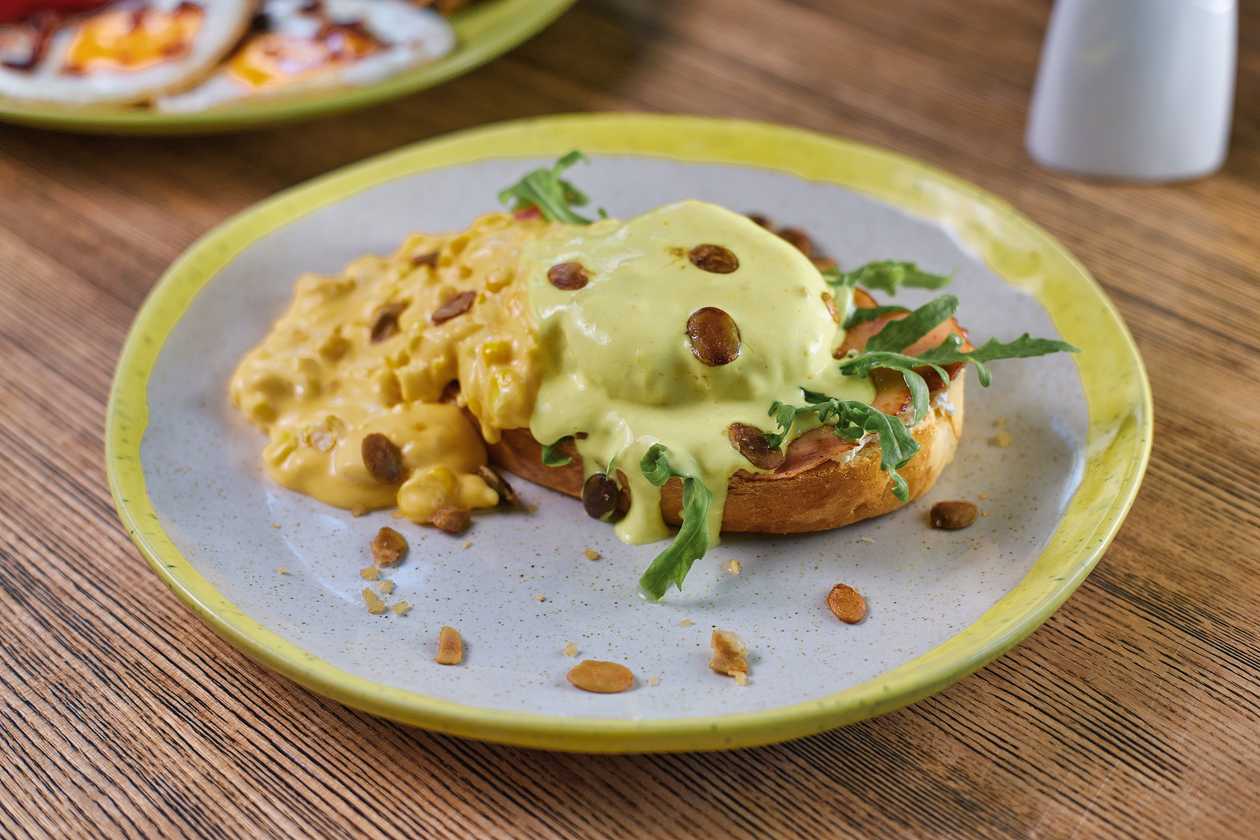 Toast with bacon and corn in cheddar cheese