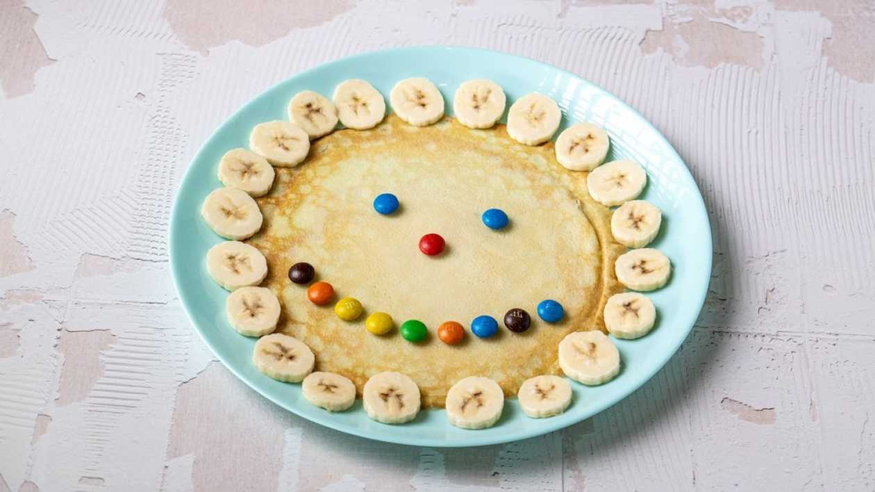 Pancakes with Banana, Dragees and Chocolate Topping
