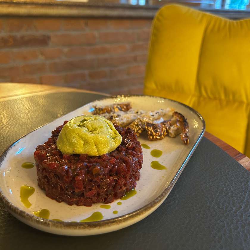 Beetroot Tartare - served with avocado sorbet & rustic bread chips