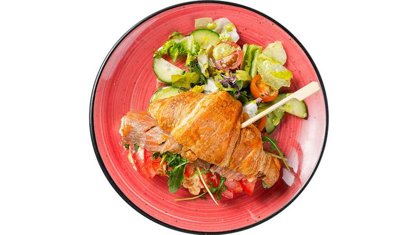 Croissant with smoked salmon and pulled scrambled eggs