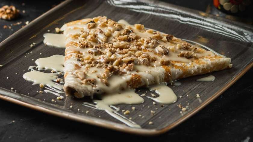 Pancake with condensed milk and walnuts